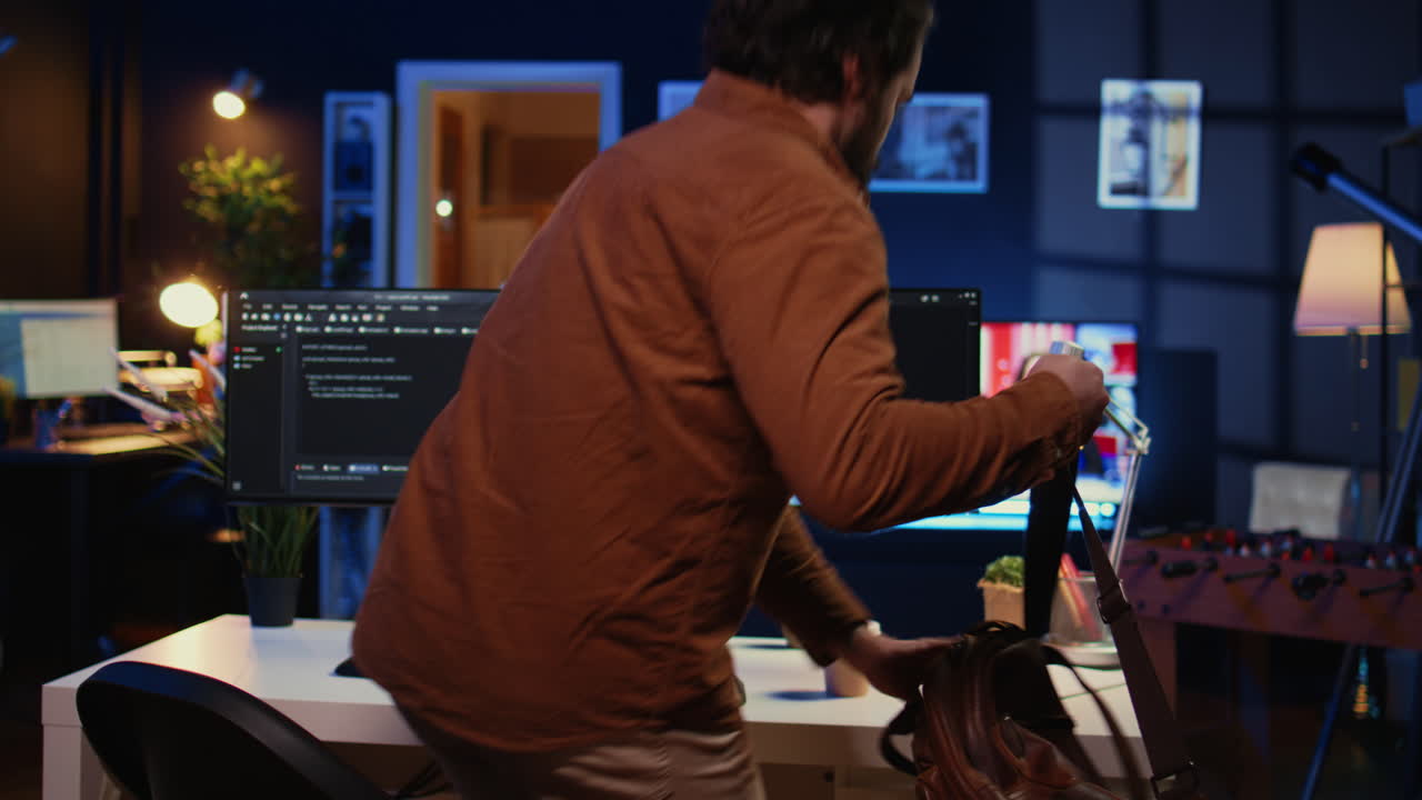 Remote software developer arriving in office at home, starting job shift