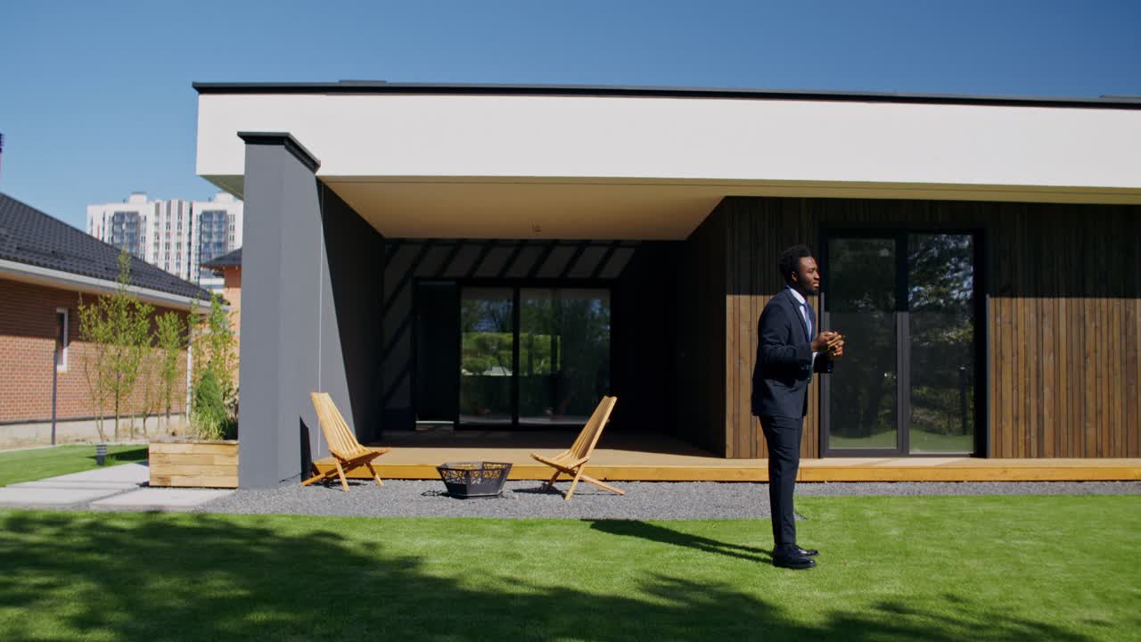 Modern House Exterior with Real Estate Agent