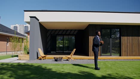 modern house exterior with real estate agent