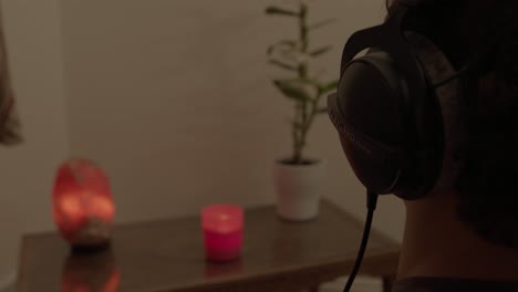 relaxing at home: listening to calming music with headphones