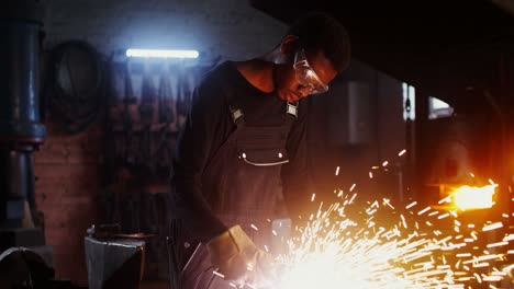 blacksmith at work in a dark workshop