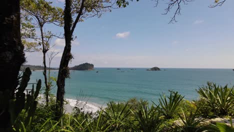 Aerial-shot-of-an-infinity-pool-with-the-beach-in-the-horizon,-Costa-Rica