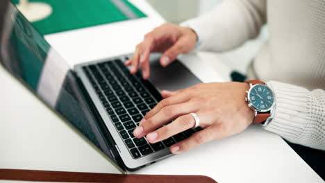 person typing on a laptop