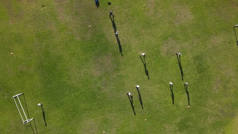 young aspiring footballers practicing soccer at football grass court