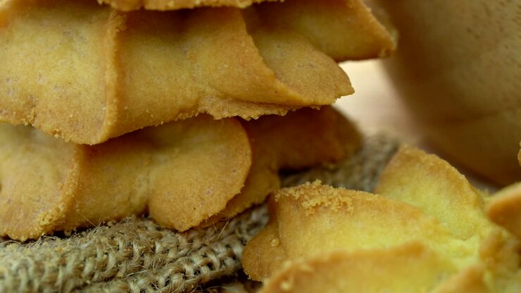 Close-up macro dolly slider butter cookies baking on wooden bowl