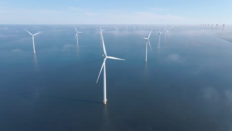 huge windmill turbines, offshore windmill farm in the ocean westermeerwind park , windmills isolated at sea on a beautiful bright day netherlands flevoland noordoostpolder