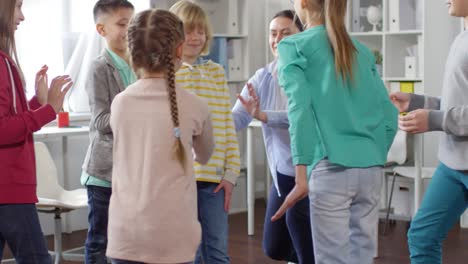 teenage boy playing trust building game with friends
