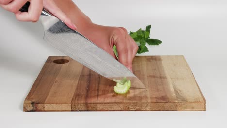 sequential images of celery being chopped finely