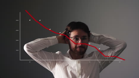 young businessman looks scared at graph with red falling curve