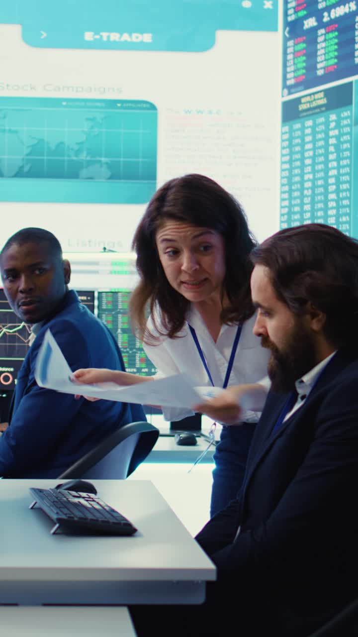 Financial Analysts Discussing Stock Market Data in Modern Office