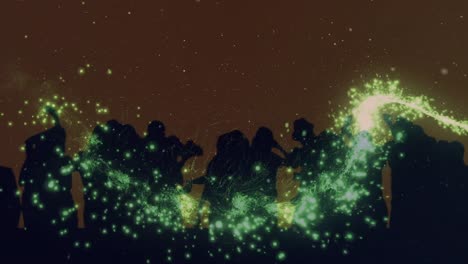 Animation-of-green-firework-over-dancing-crowd,-with-brown-background