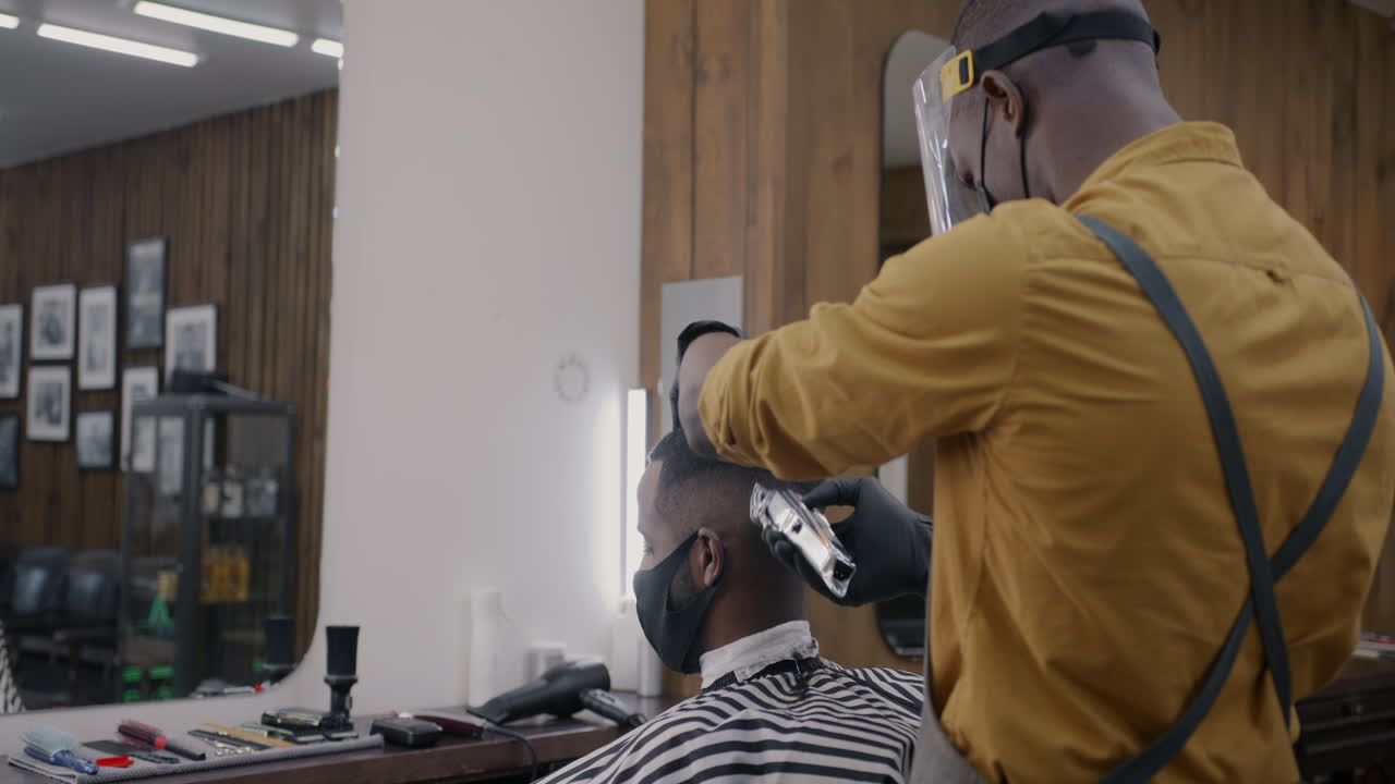 Barber Giving a Haircut During COVID-19 Precautions