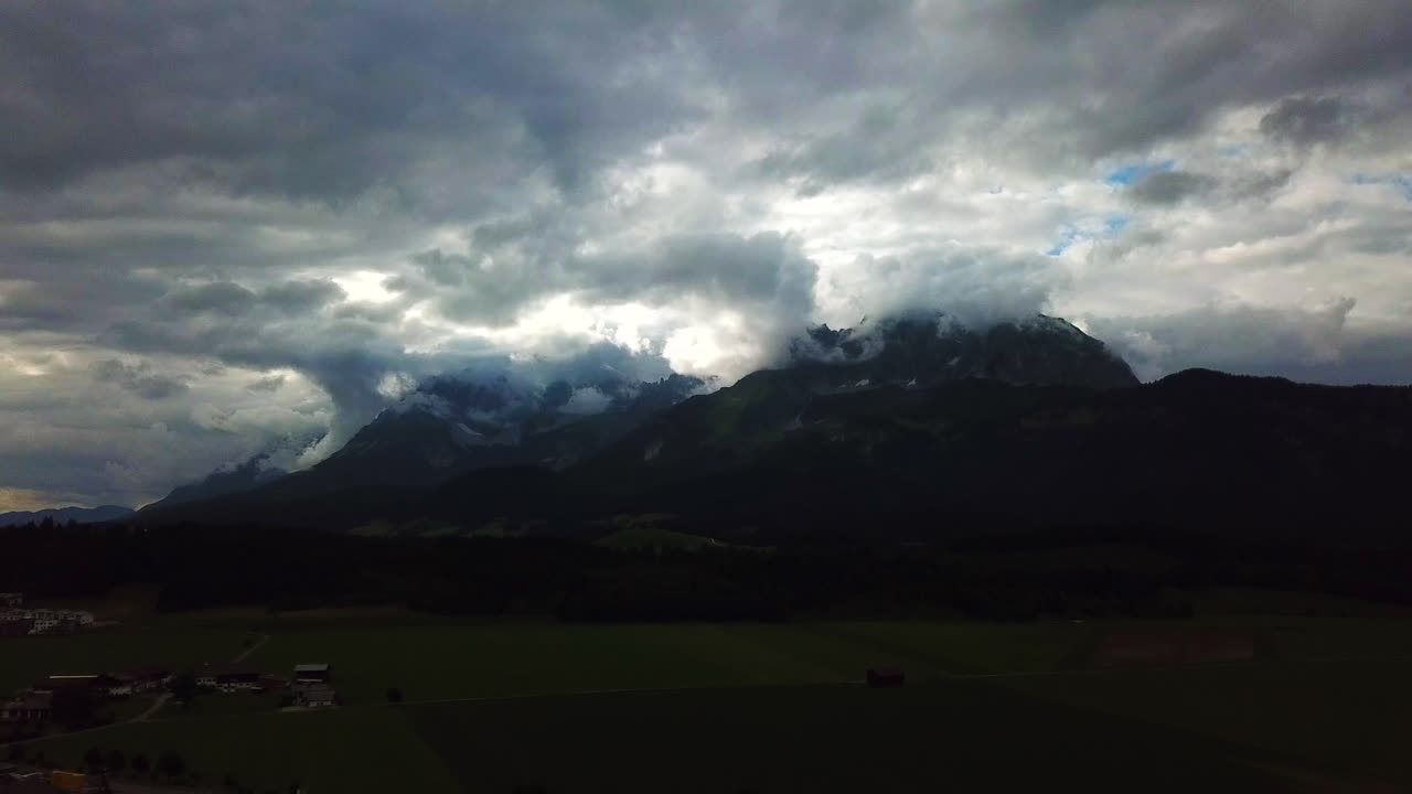 Aerial view of a stormy cloudscape above a mountain valley, Oberndorf, Austria