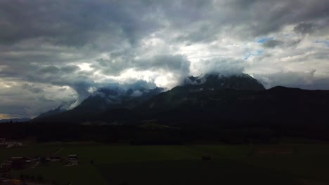 aerial view of a stormy cloudscape above a mountain valley, oberndorf, austria