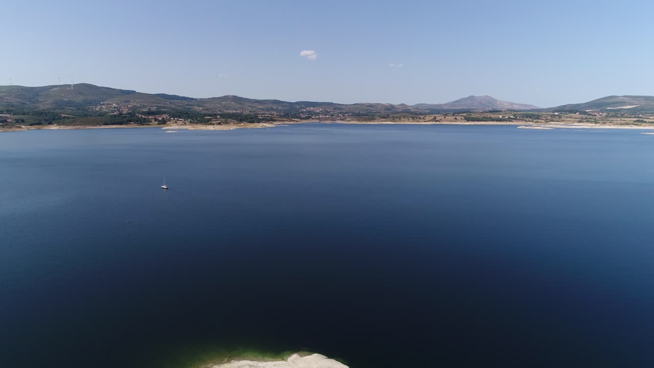 Flying Over Blue Lake High in the Mountains