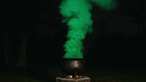 A Mysterious Cauldron Emitting Vibrant Green Smoke Against a Dark Night Sky, Creating an Enigmatic Atmosphere of Intrigue and Fascination