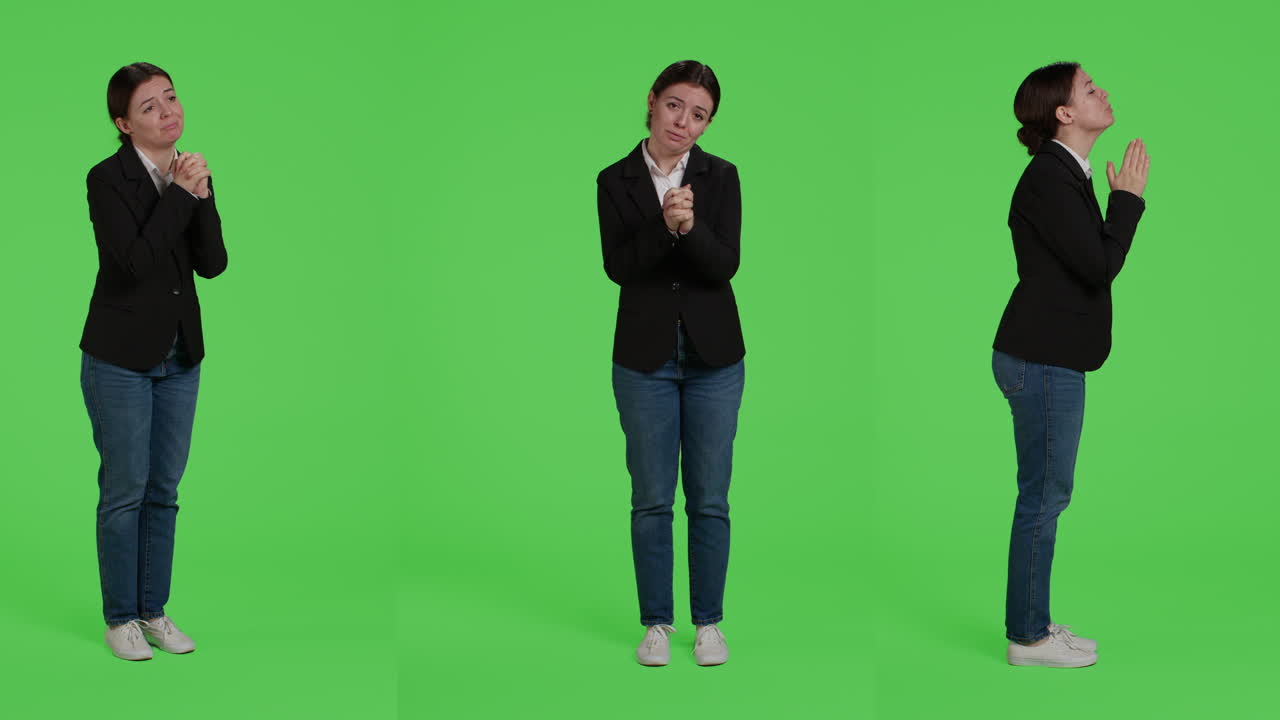 Business woman pleading in front of green screen