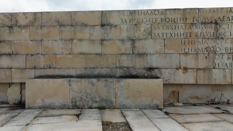 slow pan of bulgarian inscription from shipka freedom monument.