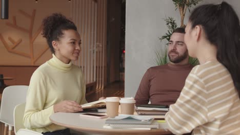 diverse friends chatting in restaurant