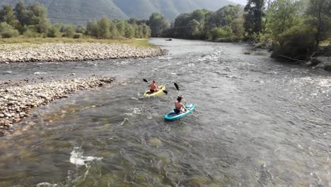 drone video following two people kayak nestos river greece panning right summer