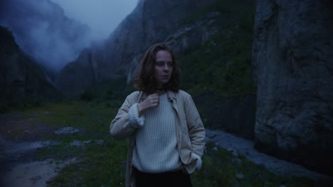 woman hiking in a misty mountain valley