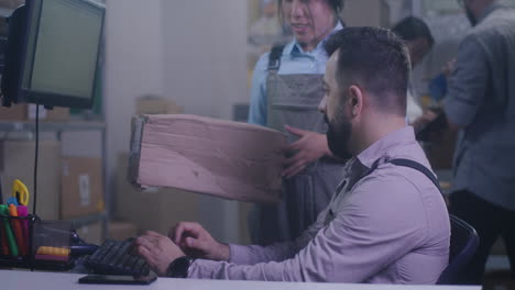 warehouse workers checking and packaging items