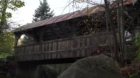 cullen central park wooden footbridge over a river in whitby, canada