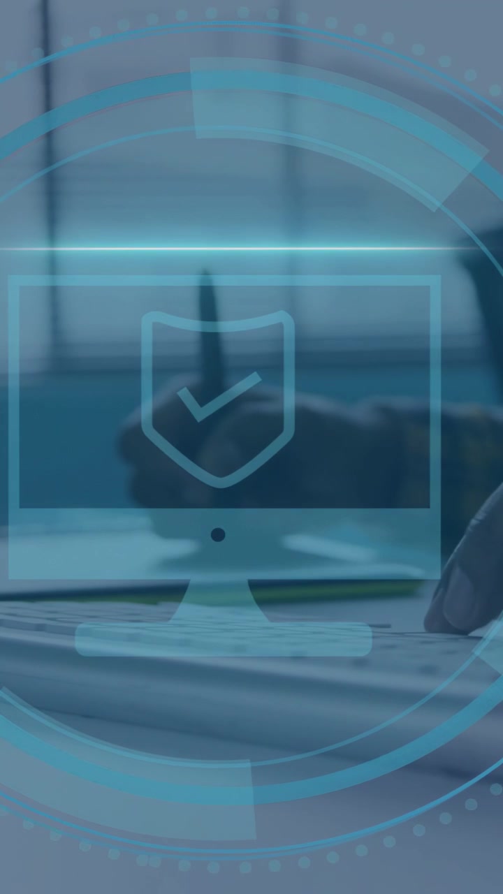 Vertical video: Office worker moving right-hand to keyboard as HUD appearing showing security check