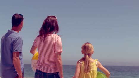 happy family posing with buoys
