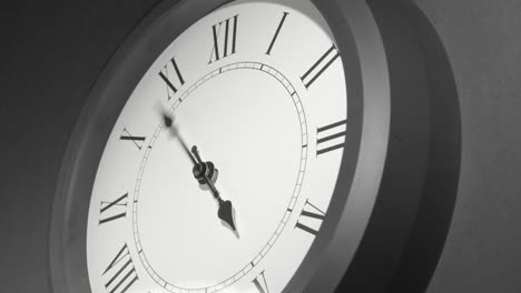 latin clock face in time lapse on dark grey wall