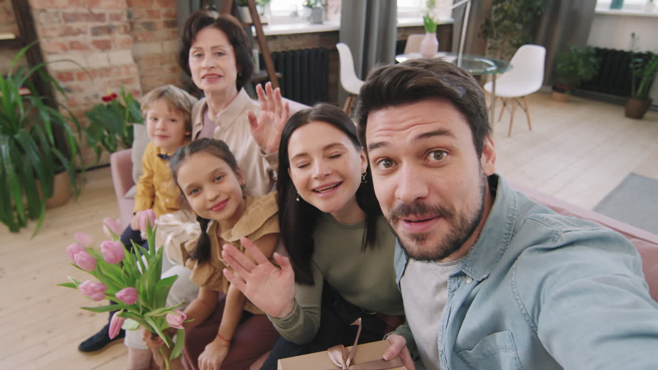 Family gathering celebrating with gifts and flowers