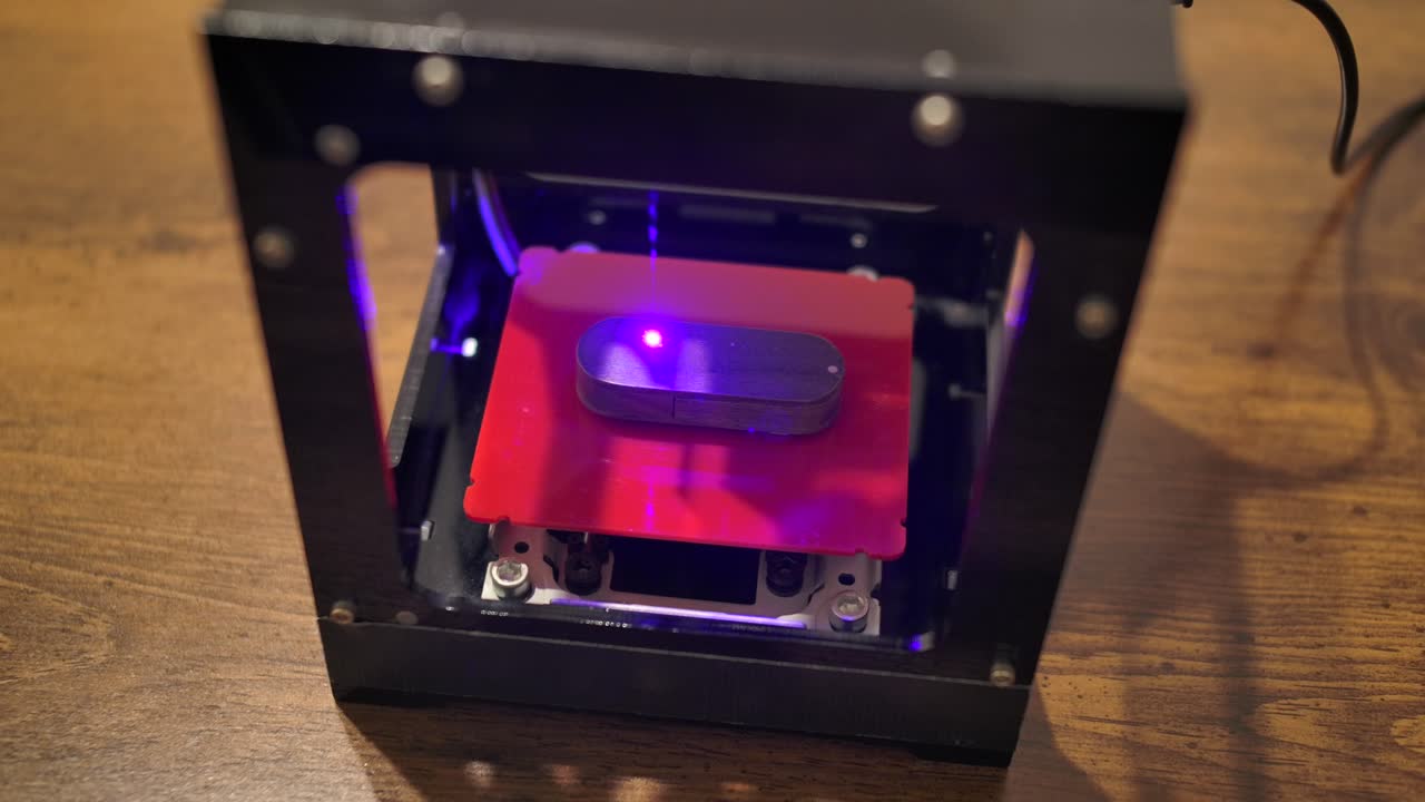 Laser machine engraving on a wooden usb stick
