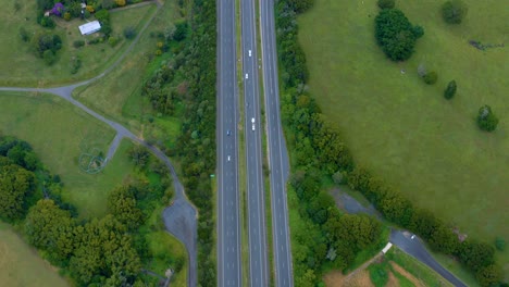 top view of pacific motorway and lush fields, road connecting byron bay and brisbane, australia - aerial drone