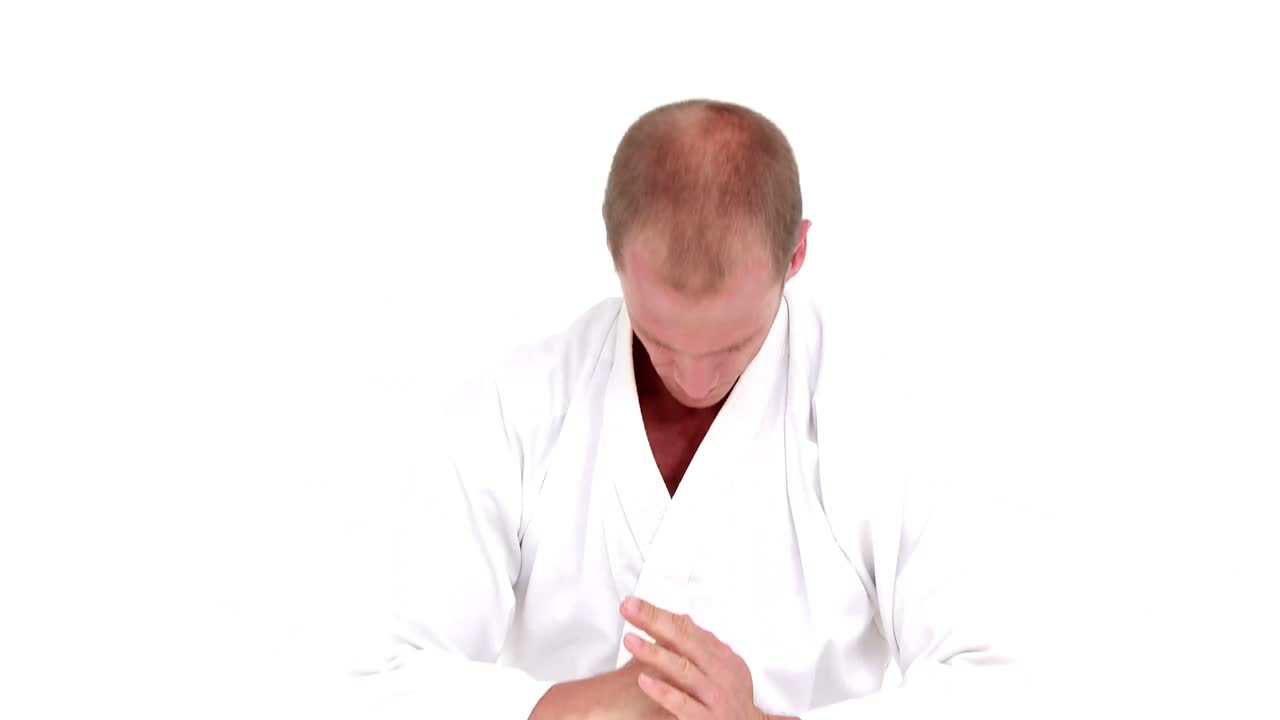 Smiling sportsman practices judo
