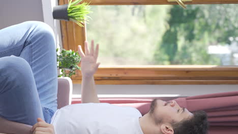 Vertical-video-of-The-man-shouting-for-help-from-the-window.