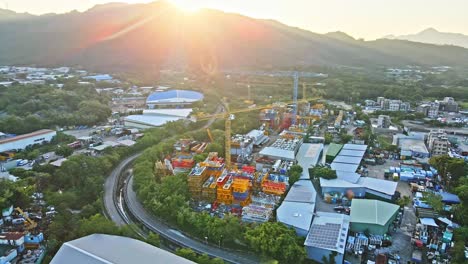 yongmao machinery tower crane storage facility in yuen long, sunset aerial drone