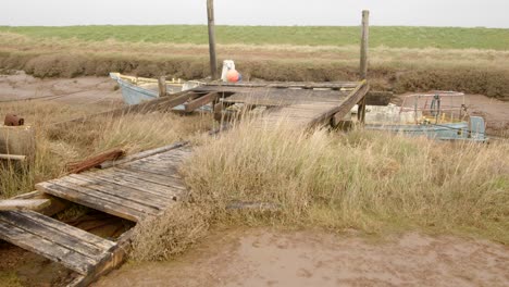 old-derelict-boat-dock-at-Steeping-River,-Gibraltar-Point