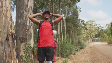 Sporty-mixed-race-man-with-prosthetic-leg-hiking