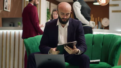 entrepreneur in suit taking notes