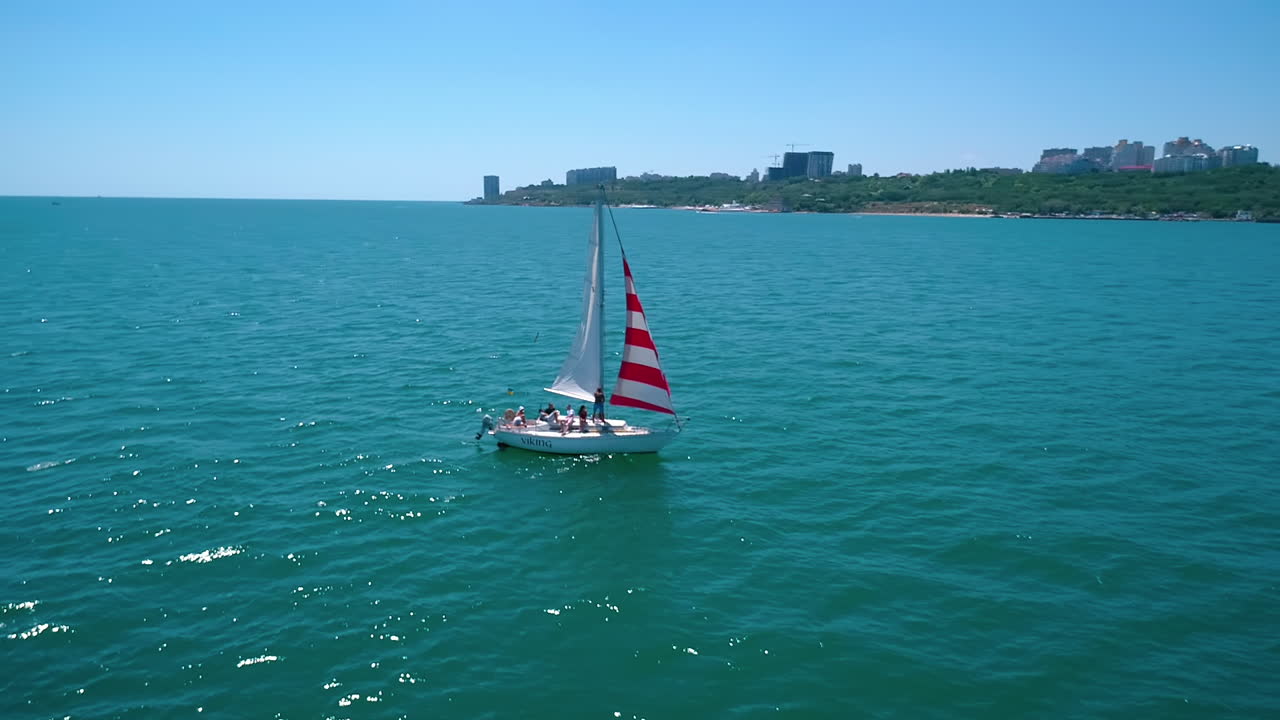 Dron view of nasty white yacht in the sea. Modern yacht driving in the ocean.