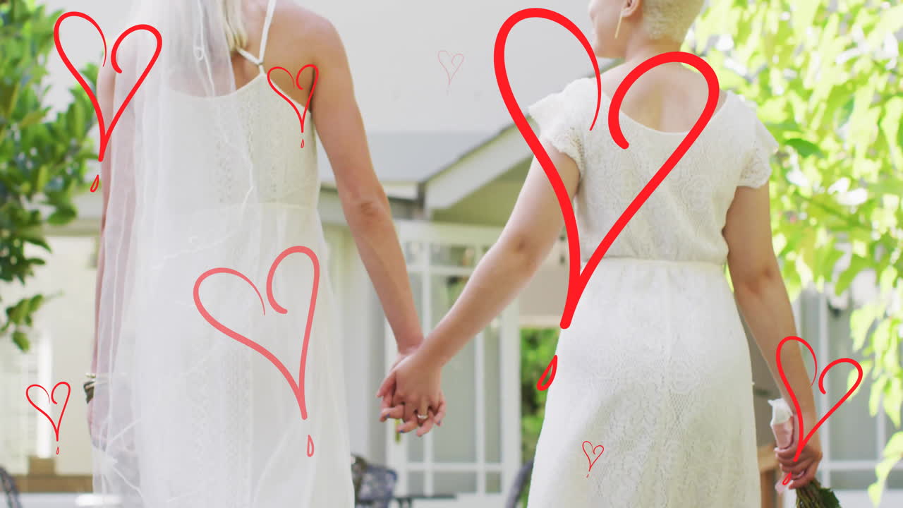 다양한 여성 부부가 손을 잡고 떠다니는 심장의 애니메이션