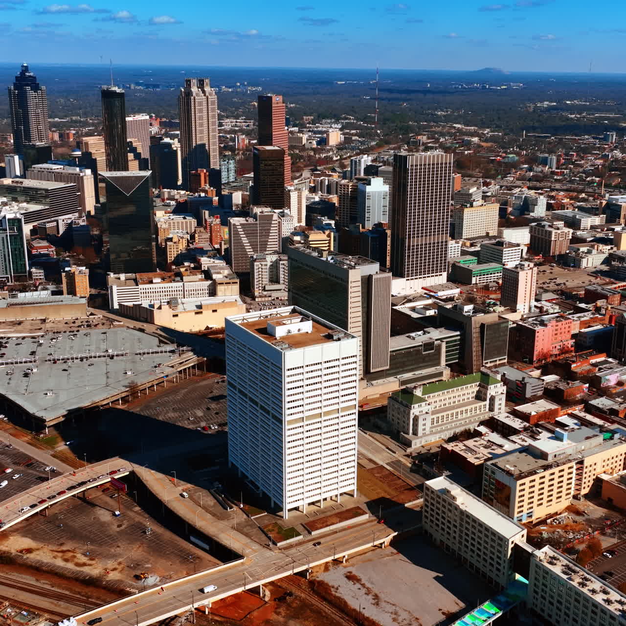 Diverse architecture in the city center with few skyscrapers standing out. Aerial view of Atlanta, Georgia, the USA.