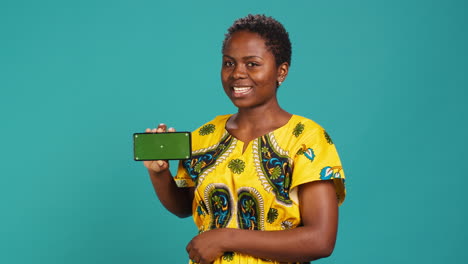 Woman-presenting-her-smartphone-with-isolated-copy-space-screen