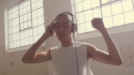 fashionable young man in an abandoned warehouse