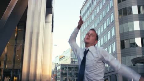 Contemporary-funky-caucasian-businessman-street-dancer-dancing-freestyle-in-the-city