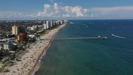 aerial hovering over a florida pier on the ocean