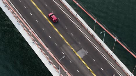 tracking car driving on suspension bridge