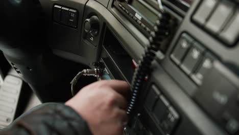 man setting up the radio on a truck