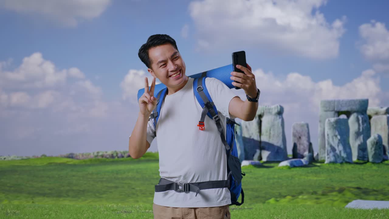 Happy Tourist Taking Selfie at Stonehenge