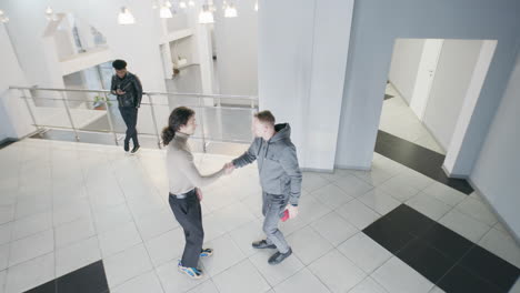 people in a modern office building lobby